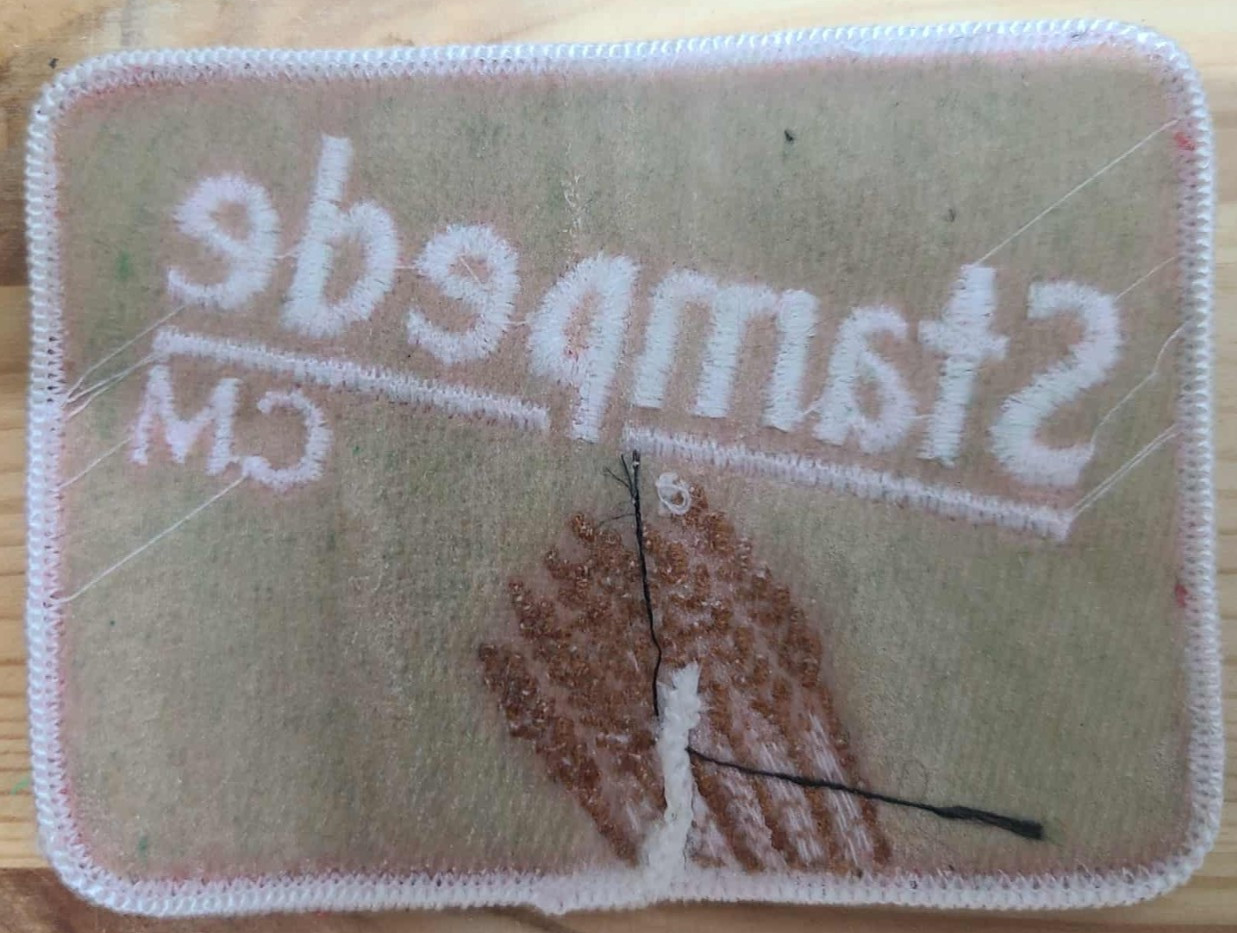 “Stampede CM Embroidered Sew-On Patch Red and White”