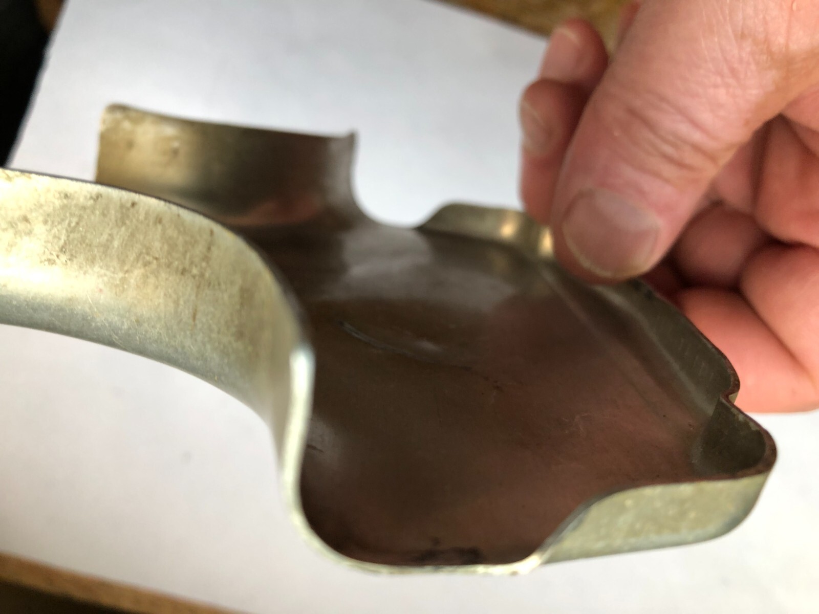 TORO Metal Marker for a Lawn Mower with the words “Clutch & Throttle” on top