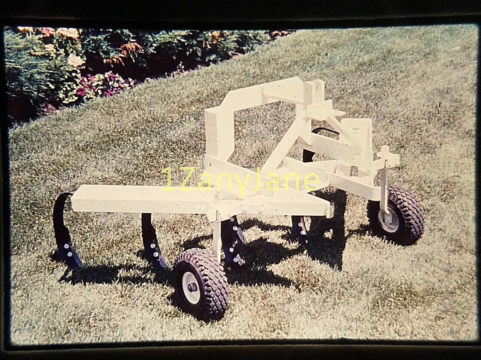 AC0403 35mm Slide of an ALLIS CHALMERS MEDIA FARM PLOW ATTACHMENT WHITE