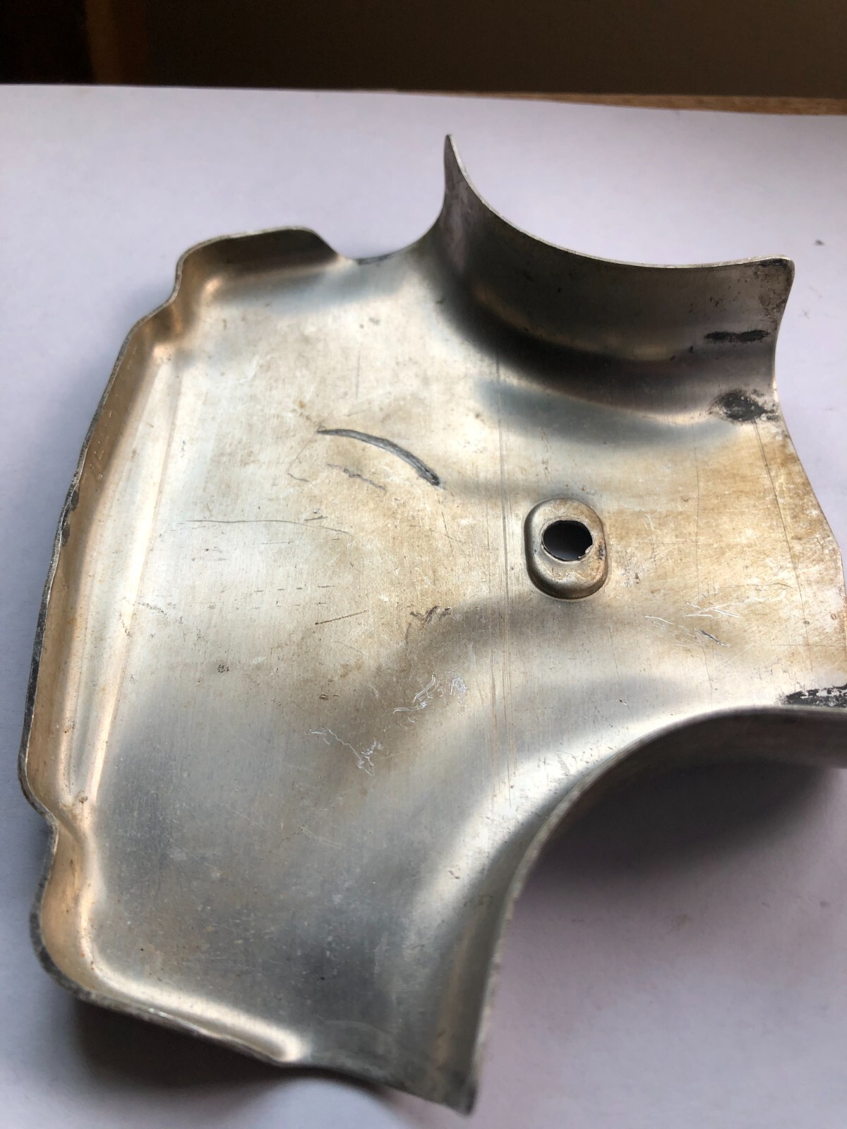 TORO Metal Marker for a Lawn Mower with the words “Clutch & Throttle” on top