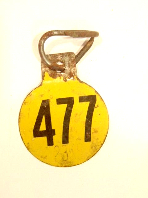 old double sided metal tag: “477”, possibly had agricultural use