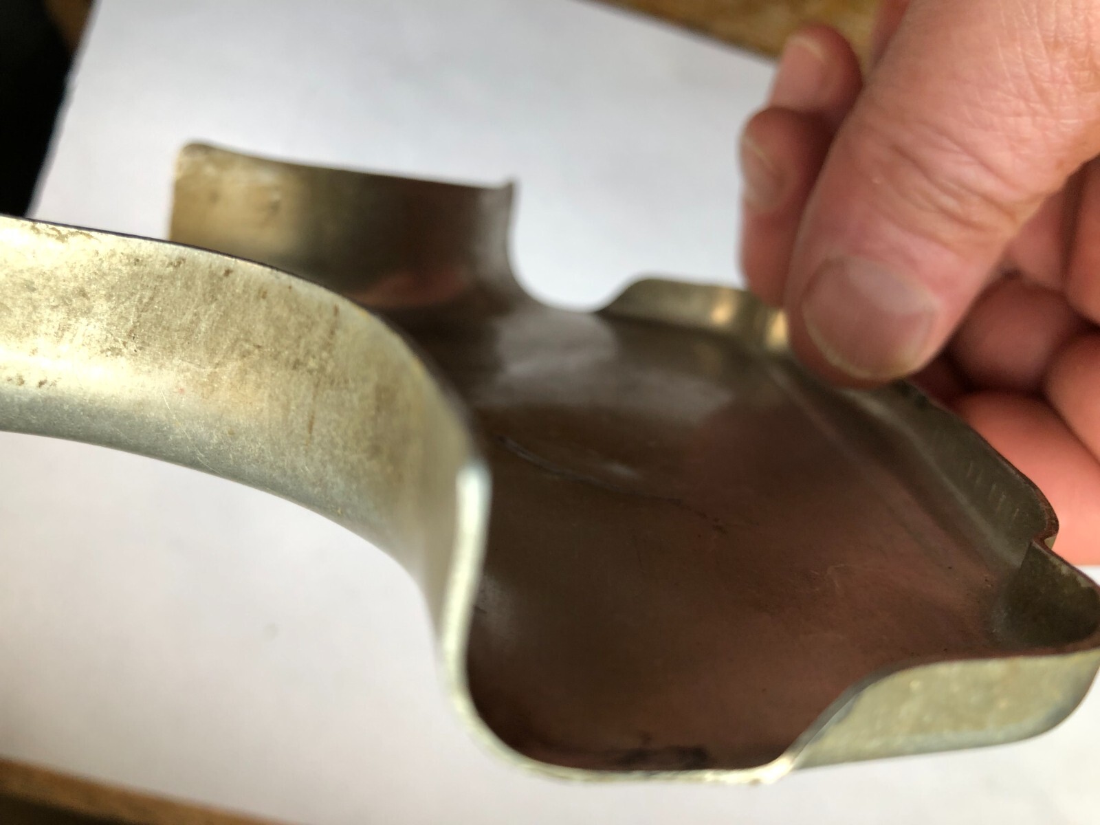 TORO Metal Marker for a Lawn Mower with the words “Clutch & Throttle” on top