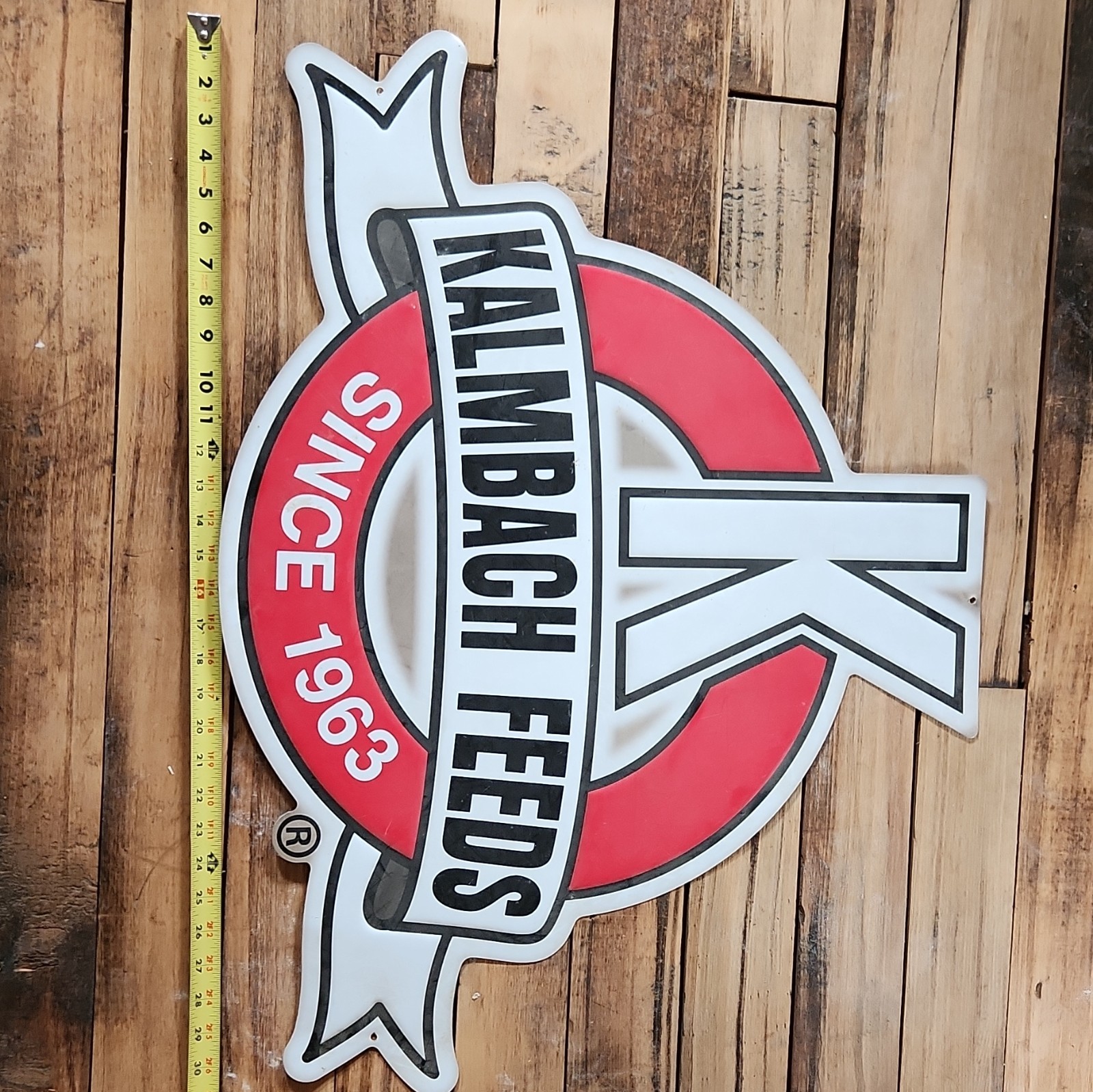 Kalmbach Feeds Tin Advertising Sign. 31″ Wide. Great Condition