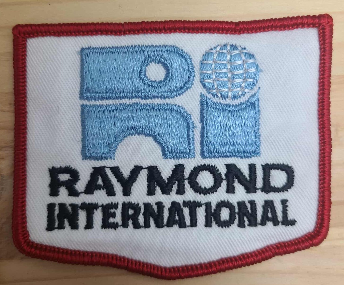 “Vintage Raymond International Embroidered Patch – Red Border”