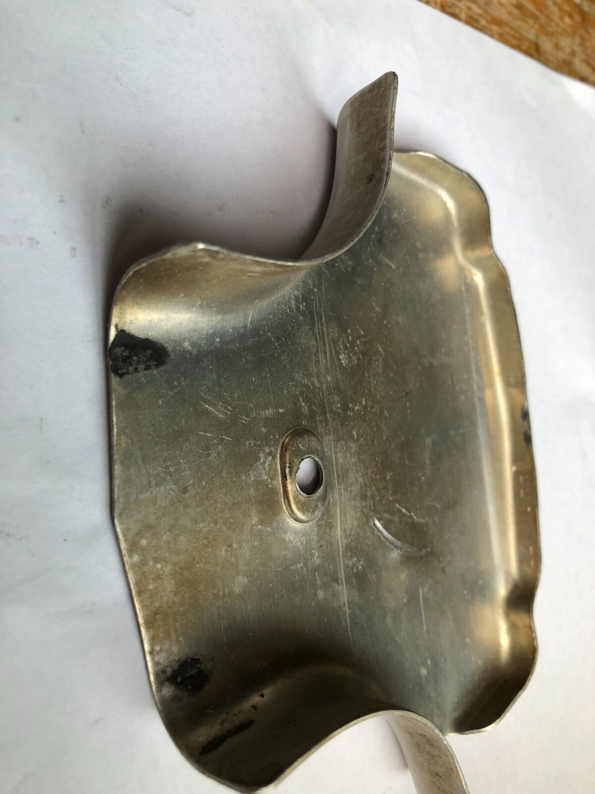 TORO Metal Marker for a Lawn Mower with the words “Clutch & Throttle” on top
