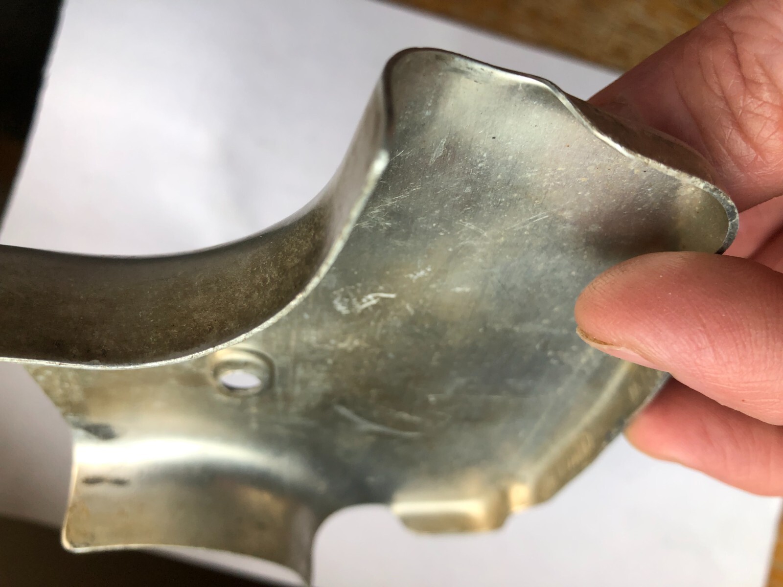 TORO Metal Marker for a Lawn Mower with the words “Clutch & Throttle” on top