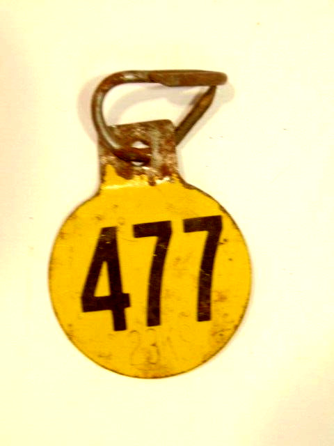 old double sided metal tag: “477”, possibly had agricultural use