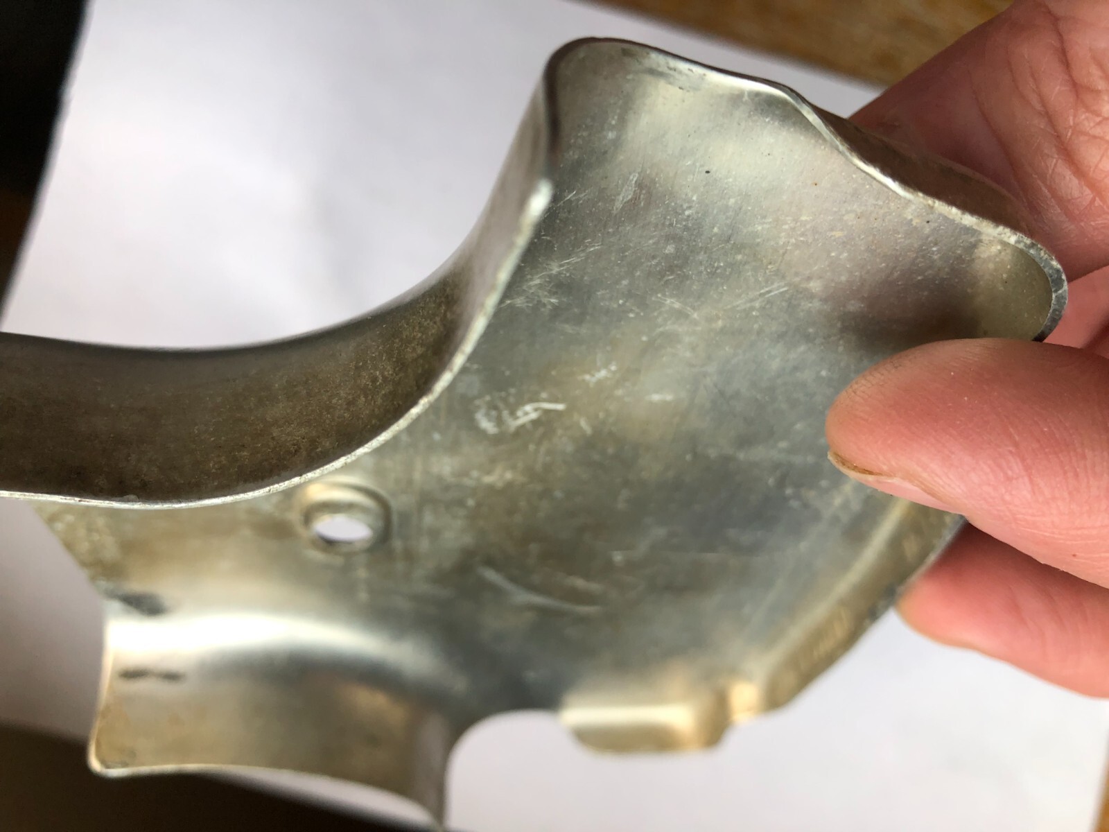 TORO Metal Marker for a Lawn Mower with the words “Clutch & Throttle” on top