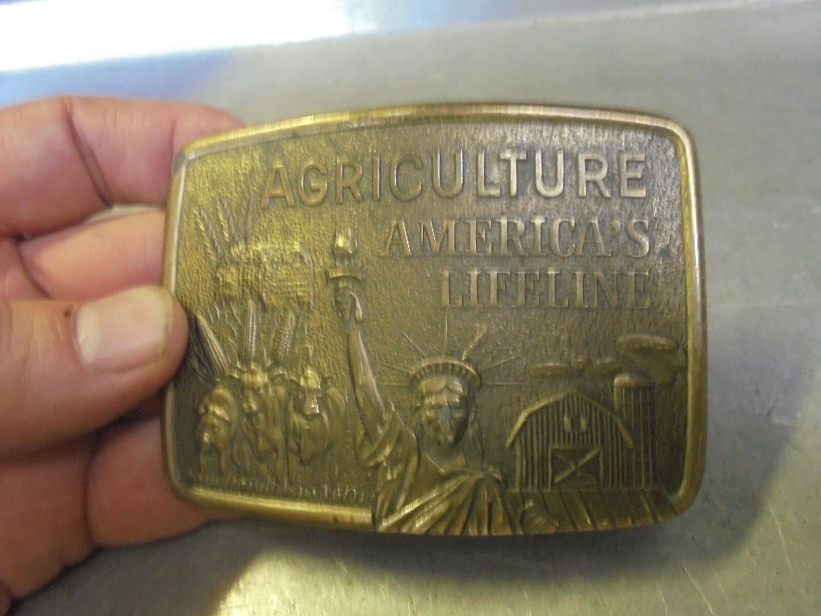 Vintage Farmhand Agriculture America’s Lifeline brass belt buckle