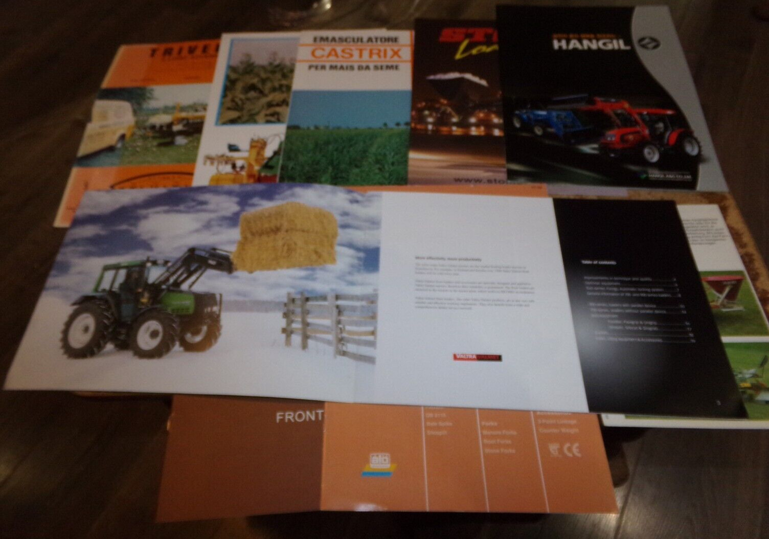 9-lot 1970’s-2010’s foreign farm equipment brochures in nice shape used