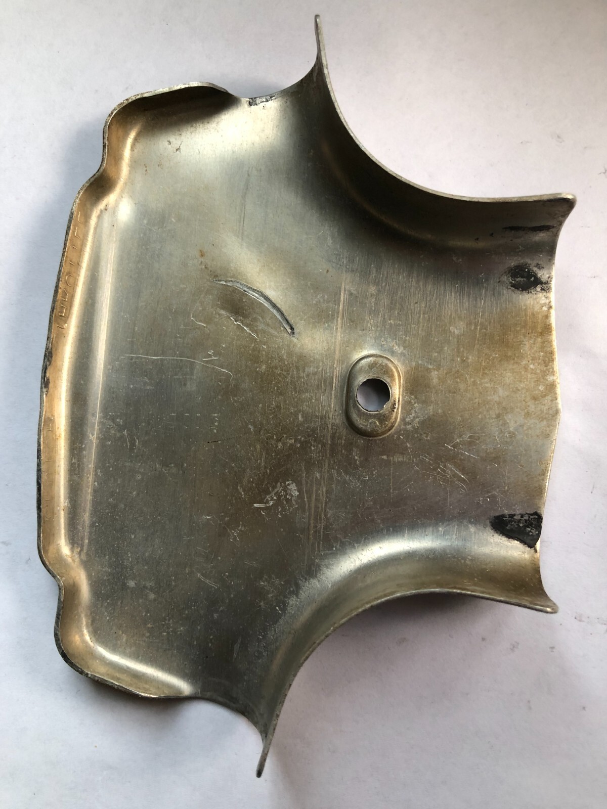 TORO Metal Marker for a Lawn Mower with the words “Clutch & Throttle” on top