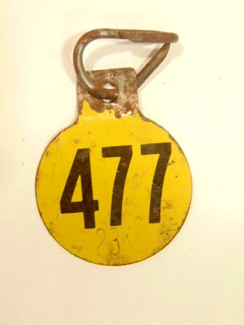 old double sided metal tag: “477”, possibly had agricultural use