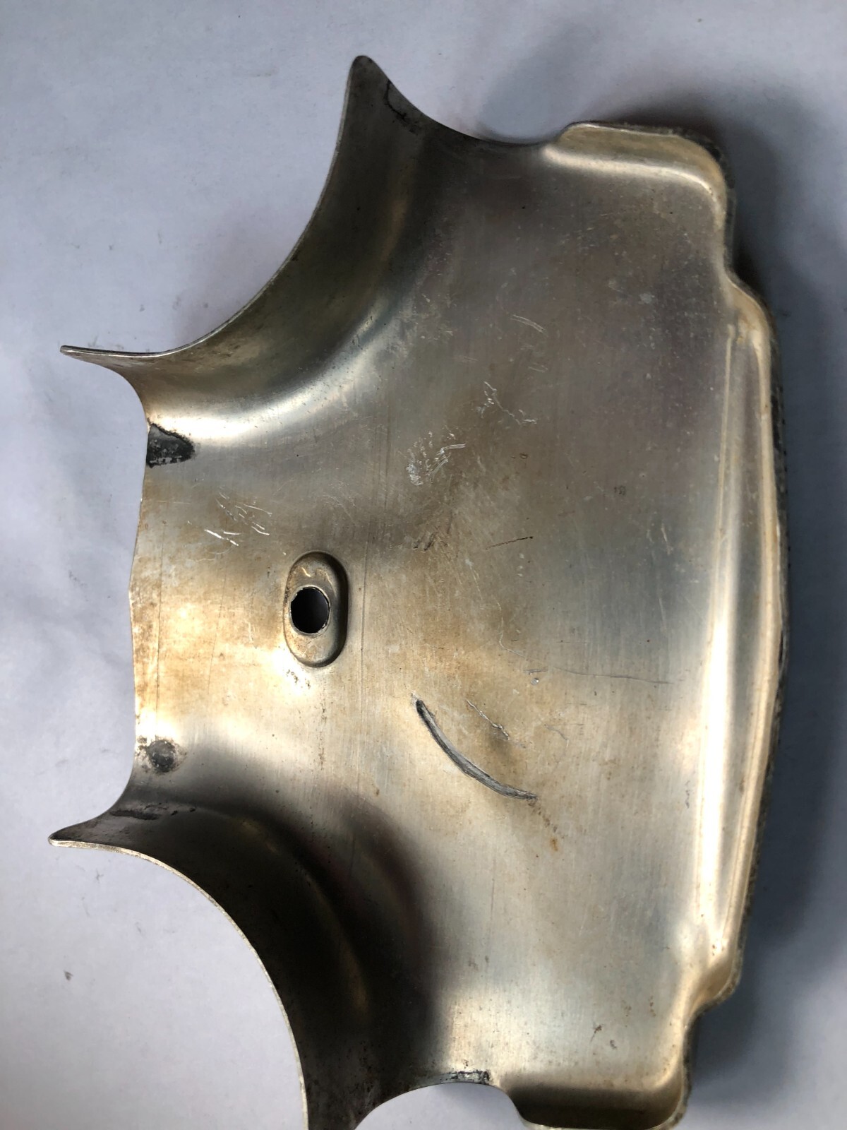 TORO Metal Marker for a Lawn Mower with the words “Clutch & Throttle” on top
