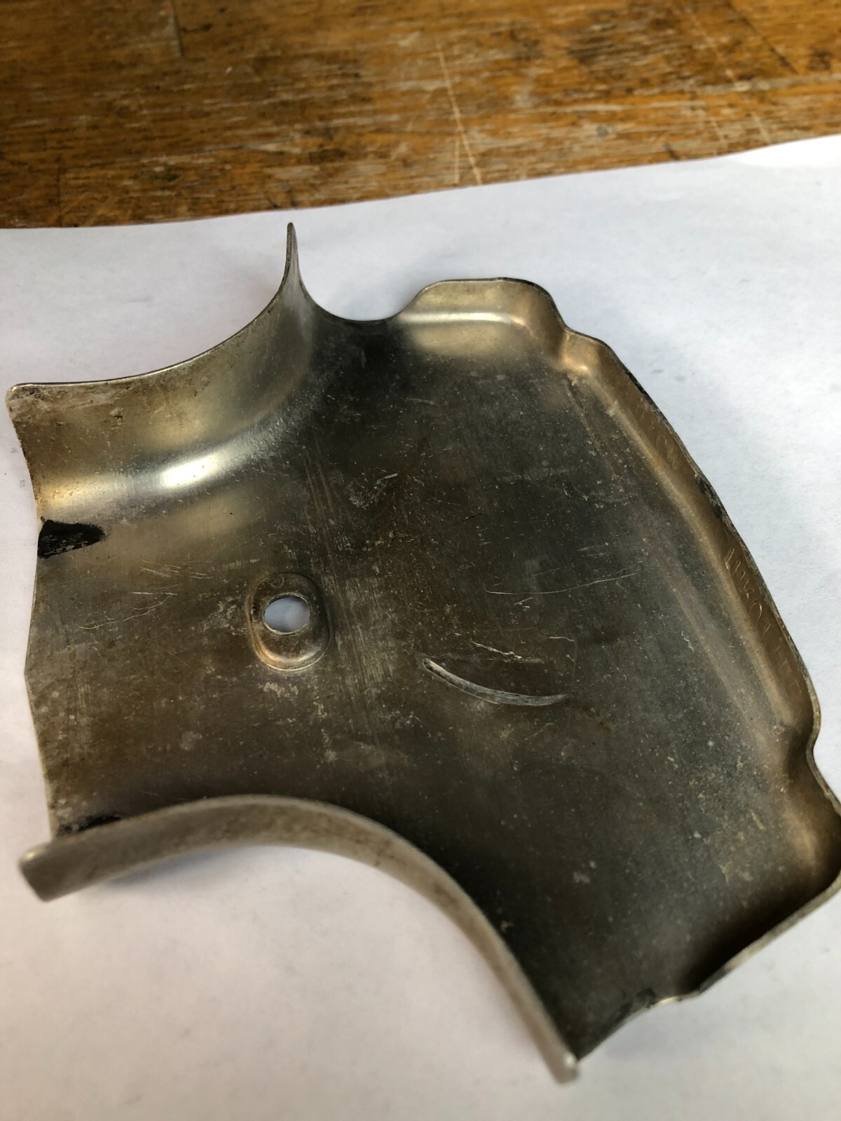 TORO Metal Marker for a Lawn Mower with the words “Clutch & Throttle” on top