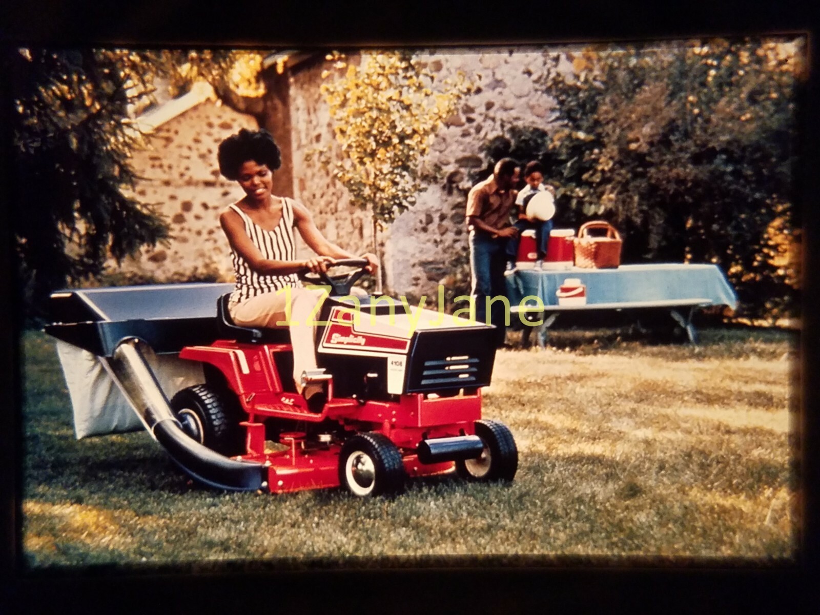 AC2003 35mm Slide of an Allis-Chalmers from MEDIA ARCHIVES WOMAN GARDEN TRACTOR