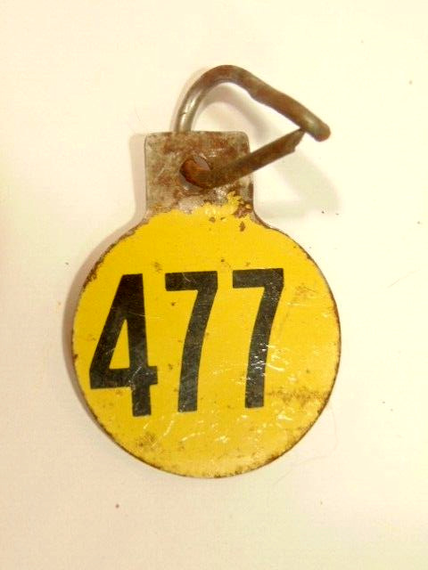 old double sided metal tag: “477”, possibly had agricultural use