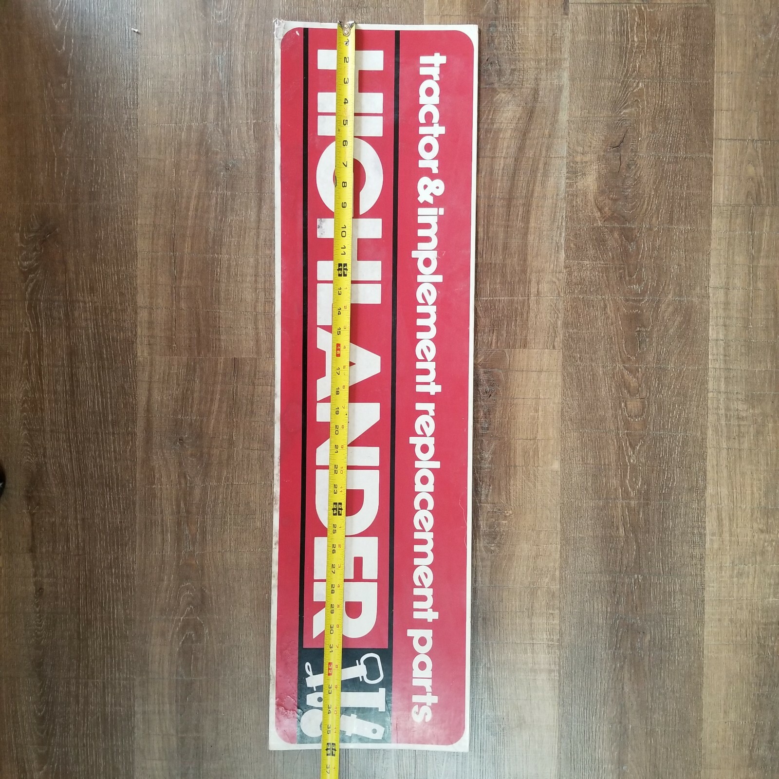 Vintage Cardboard Sign HIGHLANDER Tractor & Implement Replacement Parts 36 x 10″