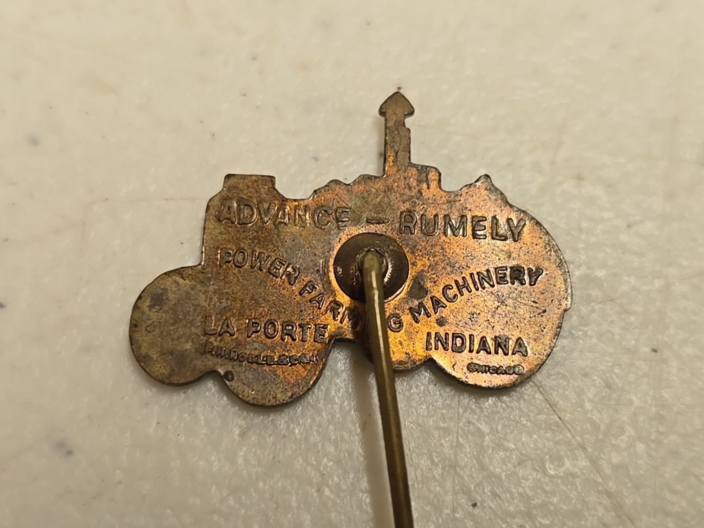 Antique 2.5″ Brass Advance-Rumley La Porte IN Advertising Tractor Stick Pin