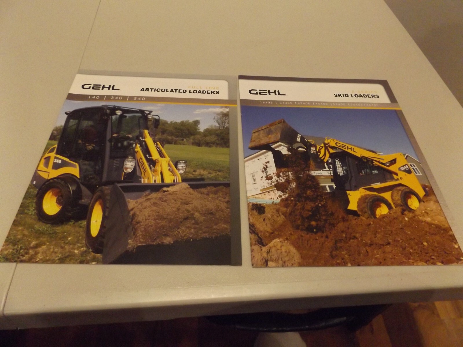 2-pc. GEHL SKID LOADERS, GEHL ARTICULATED LOADERS, ESL-15M 7/11, AL-0211-15M